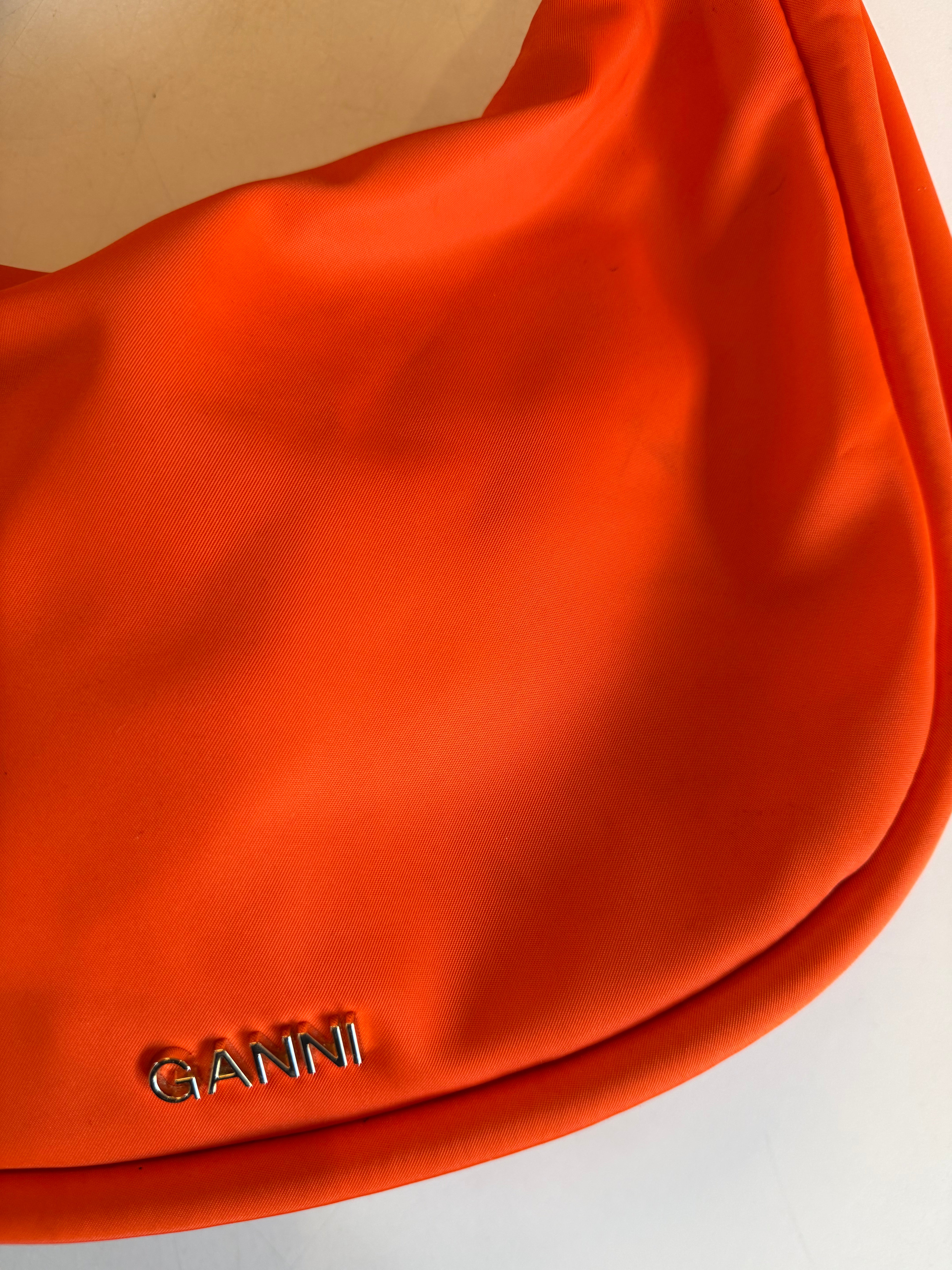orange ganni crescent tie bag