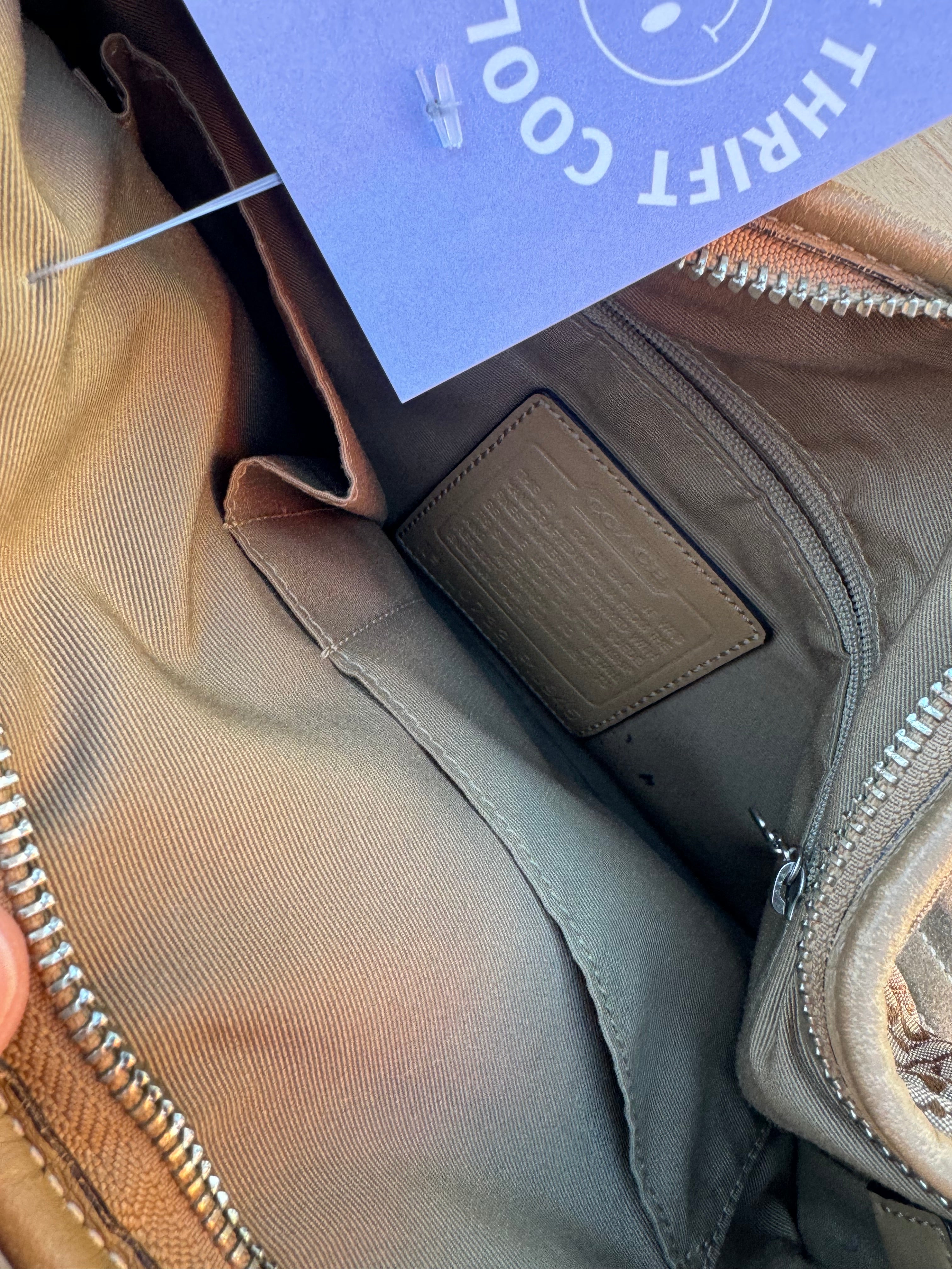 brown coach branded purse