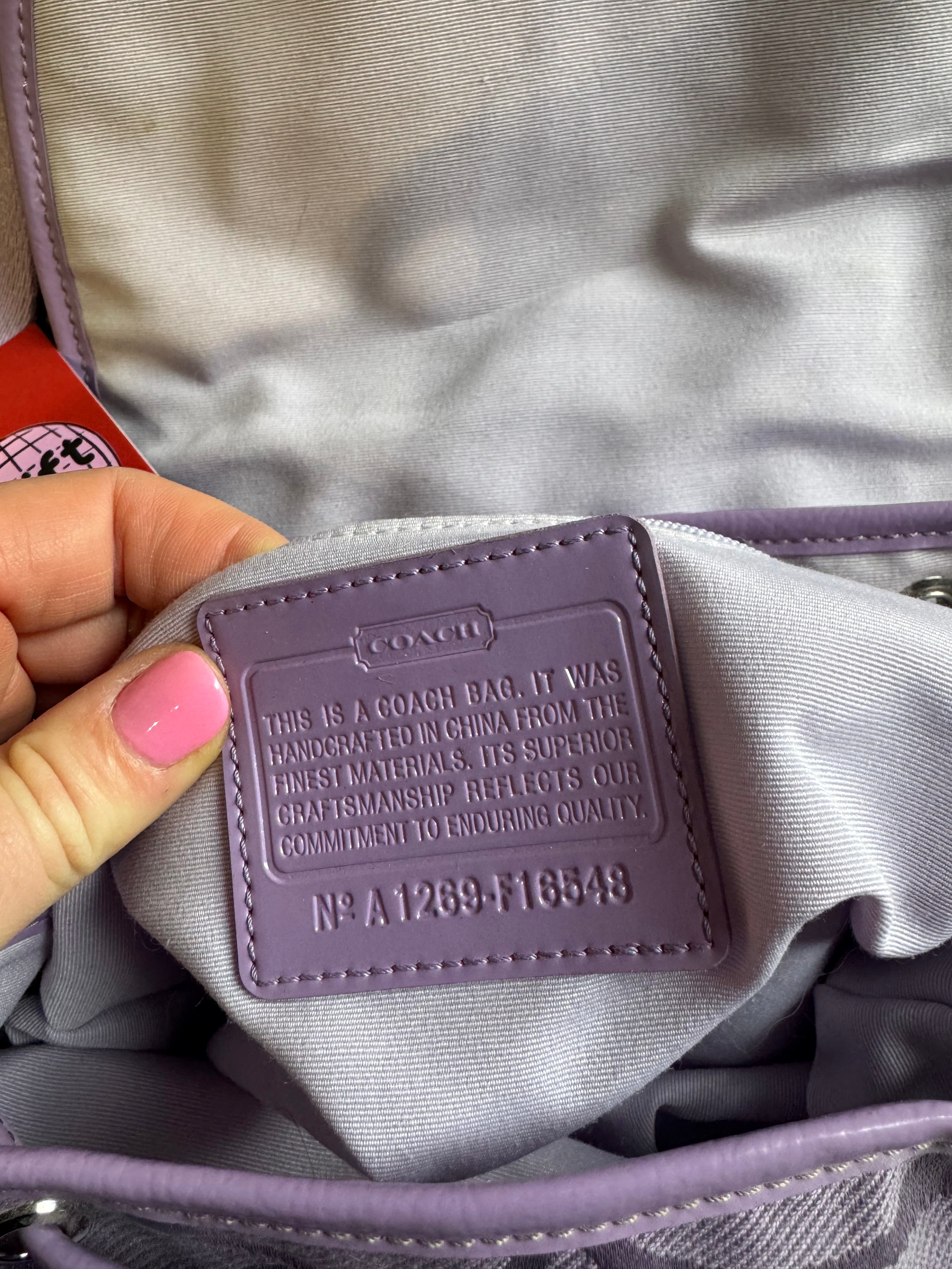purple coach branded kyra daisy backpack