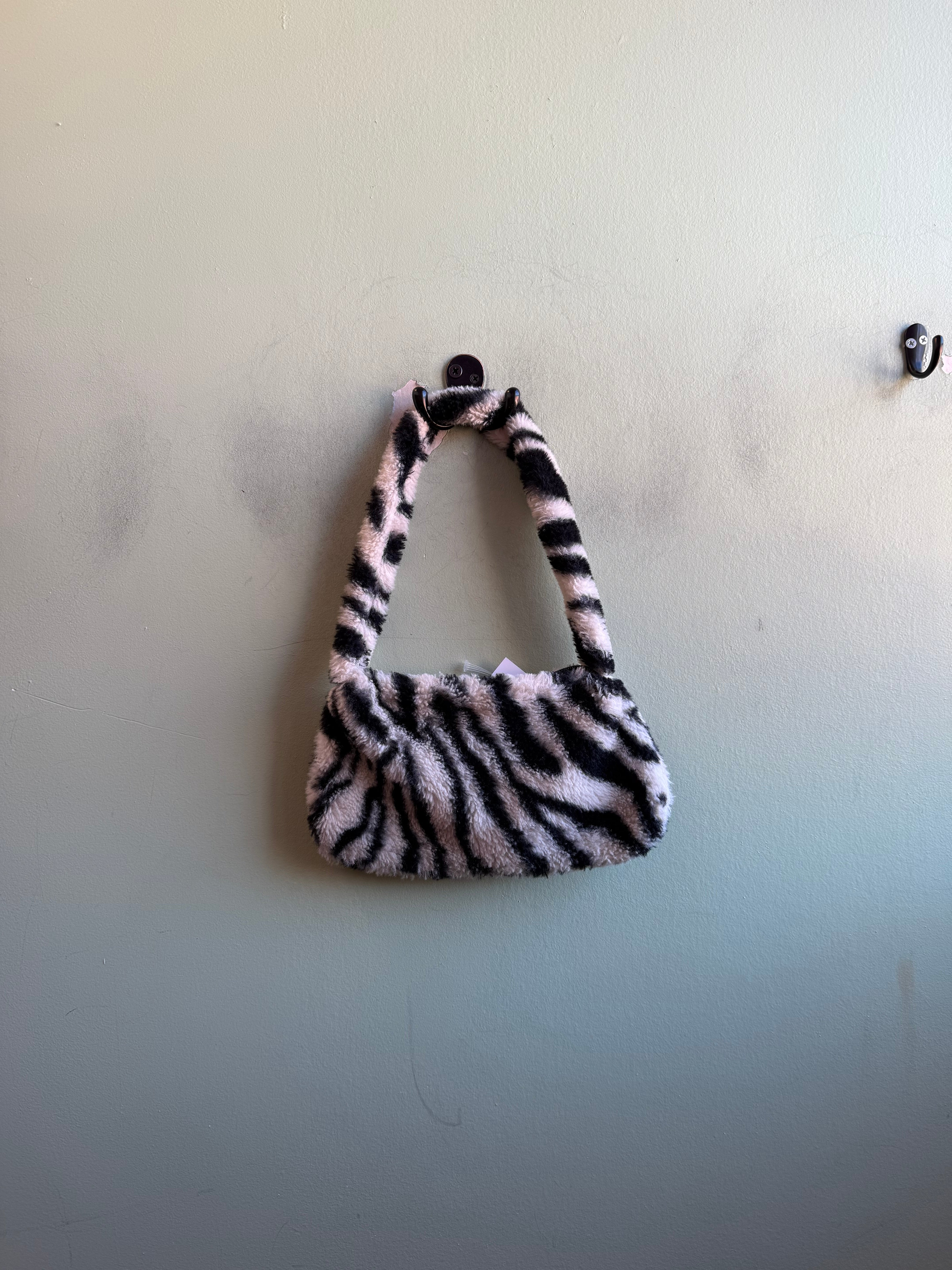 black white  fuzzy zebra bag