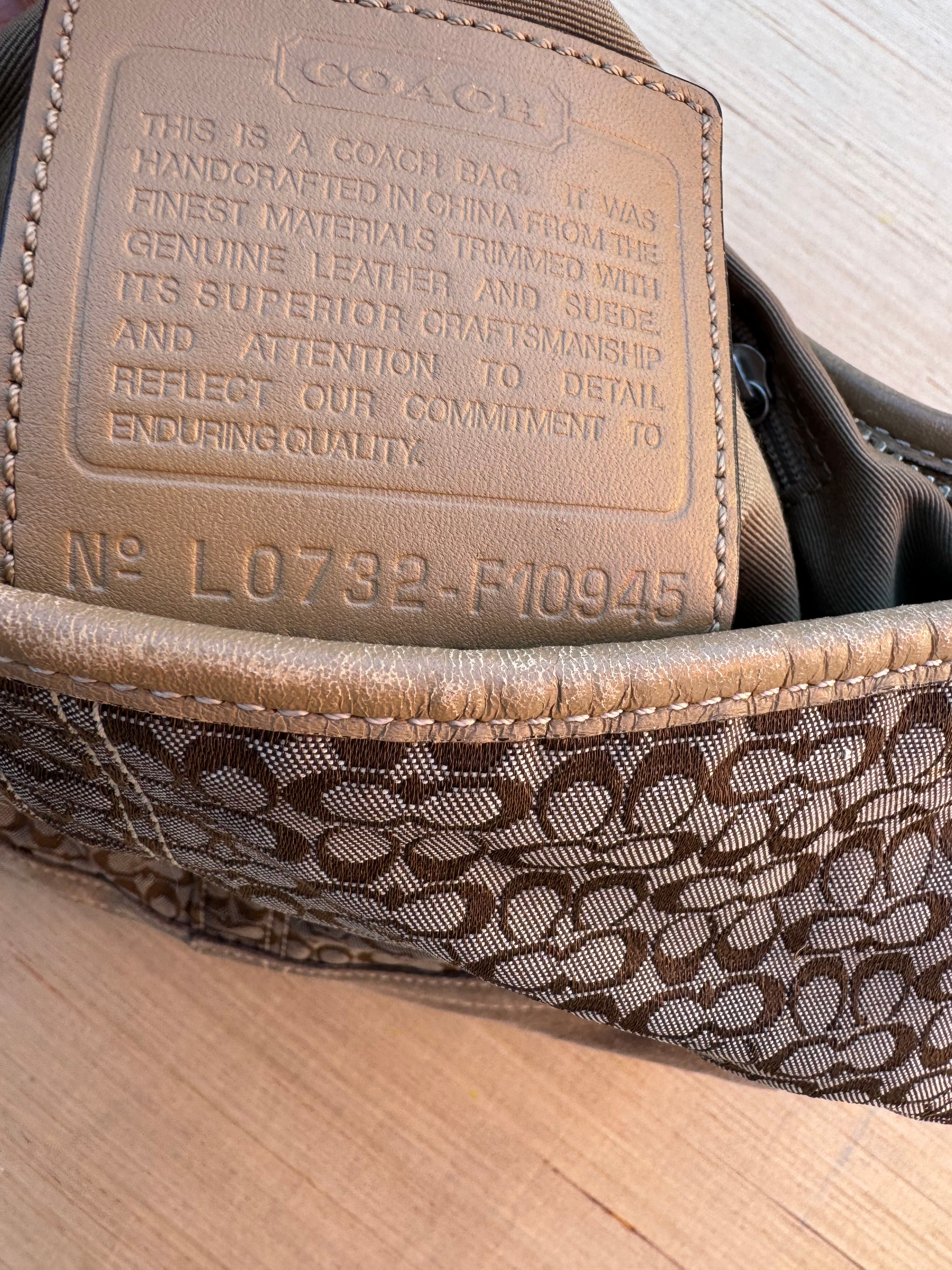 brown coach branded purse