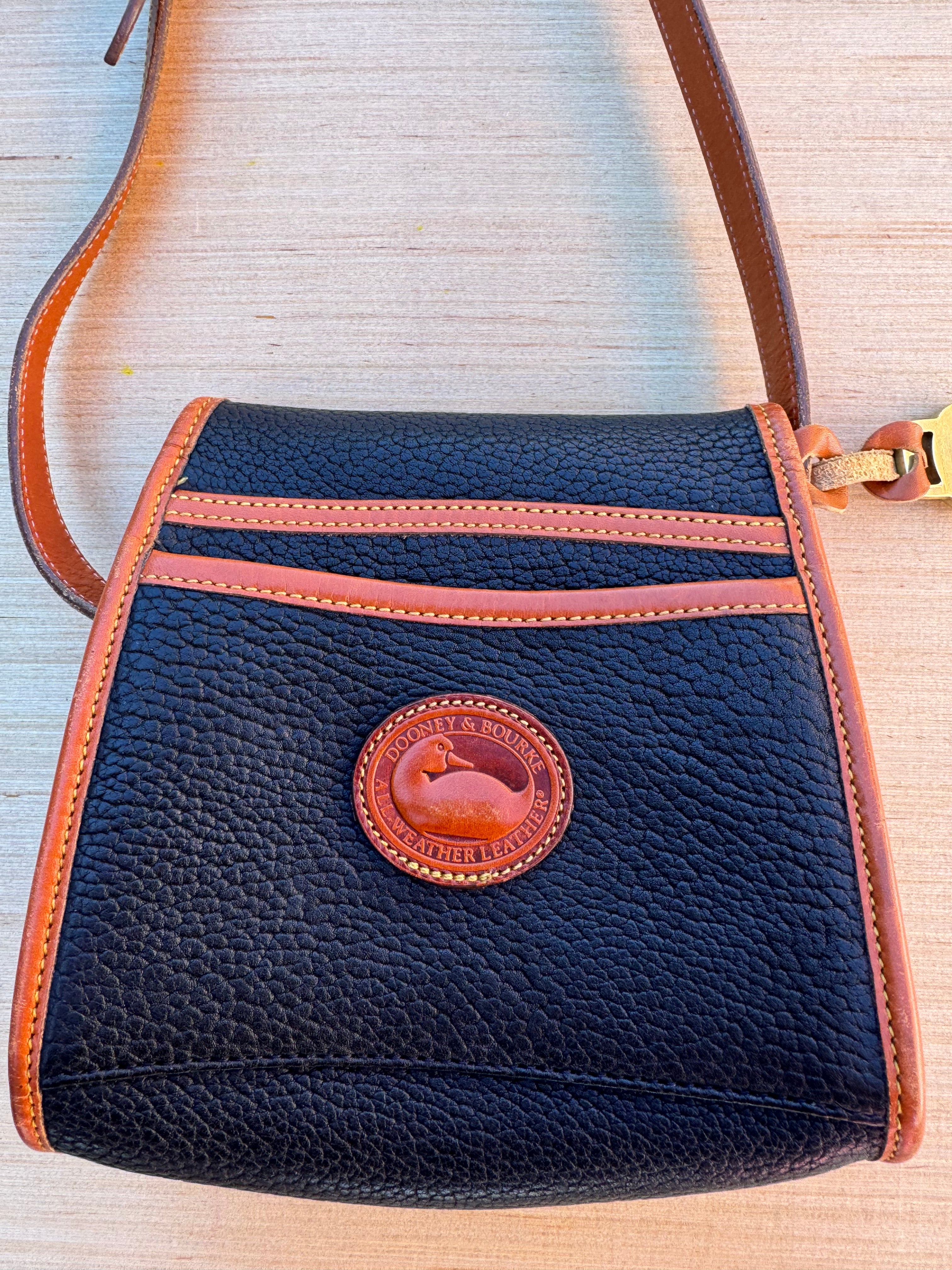 navy brown Dooney & burke crossbody bag
