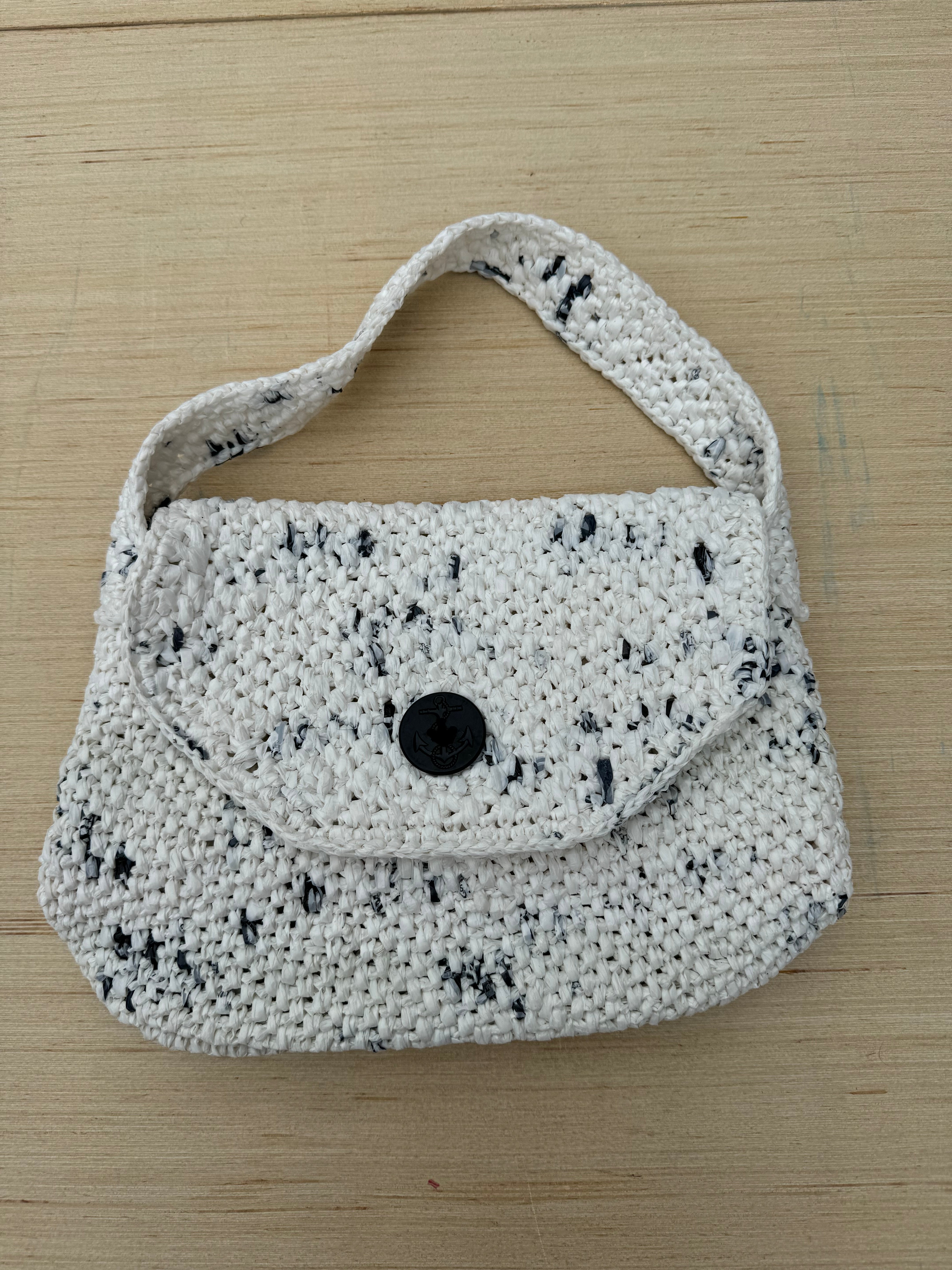 white woven recycled plastic bag purse