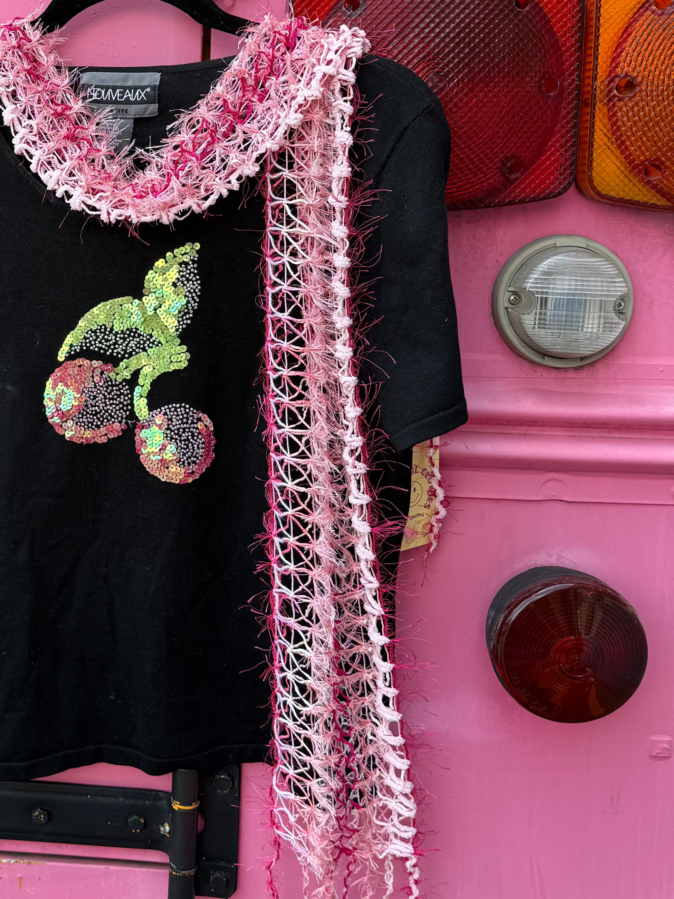 pink  frilly crochet scarf