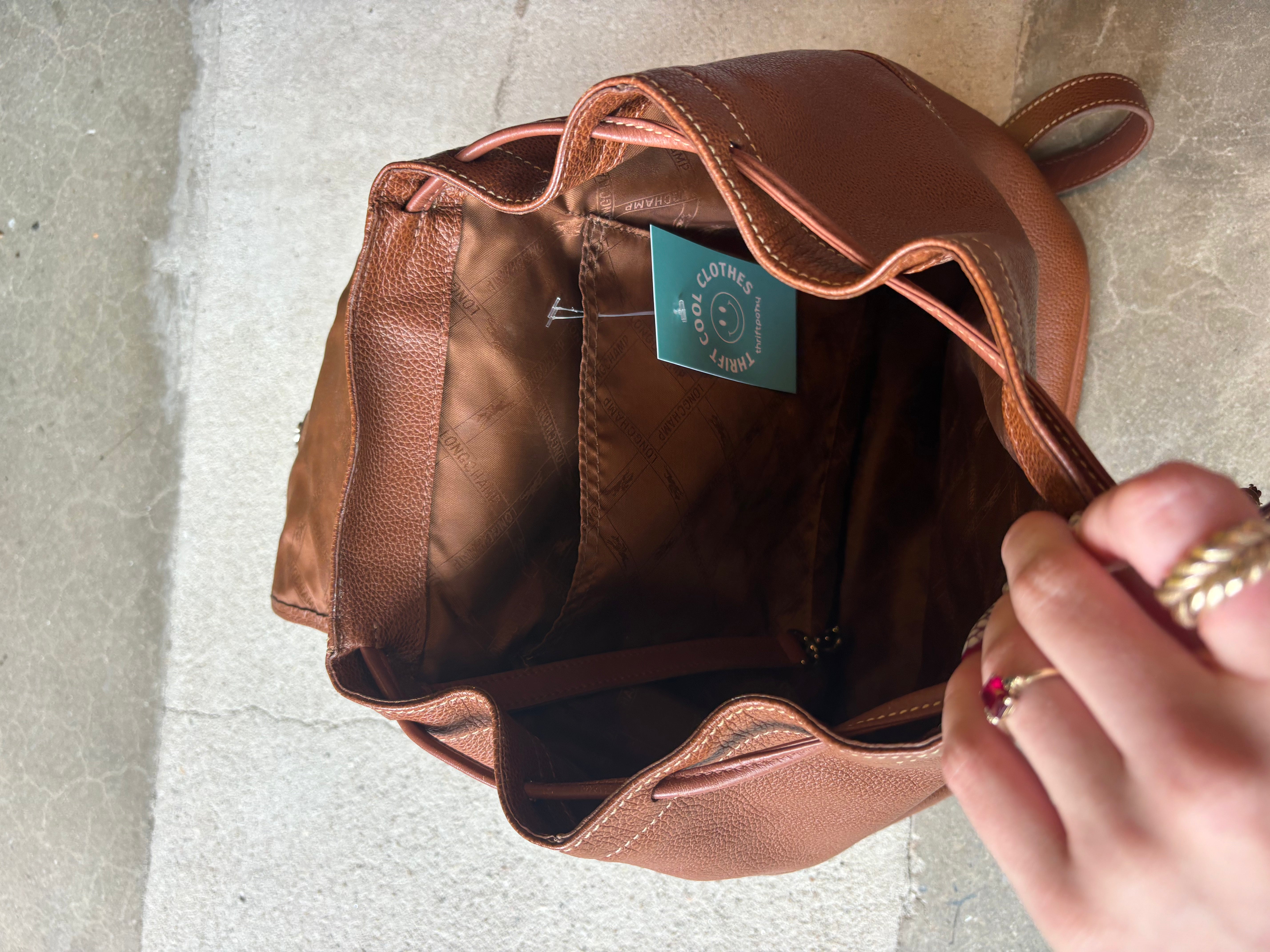 brown long champ leather backpack