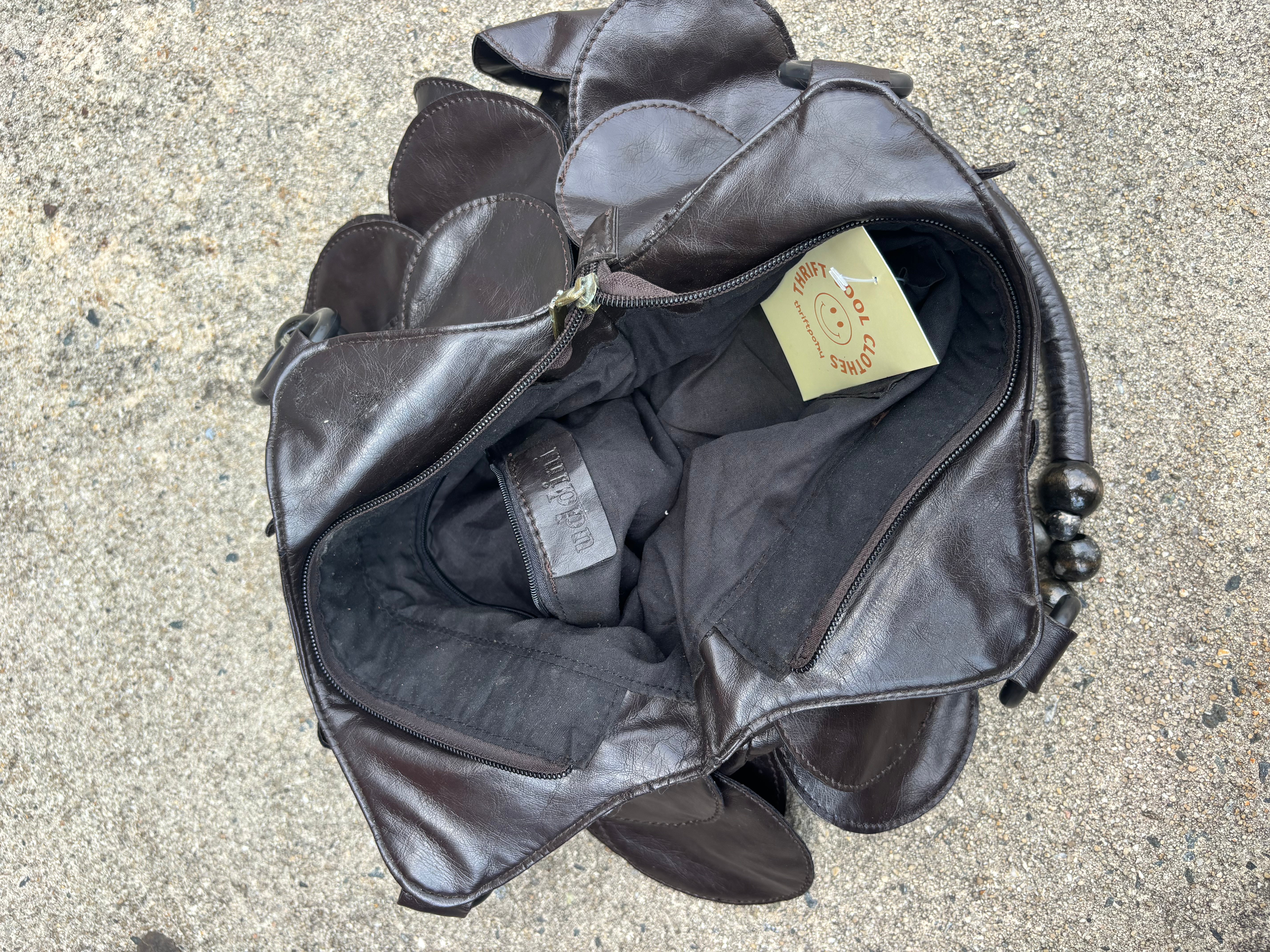 black  leather bag w floppy leather disks